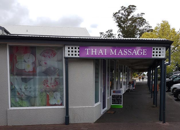 Standing outside looking at Sawaddee Thai Massage building and sign