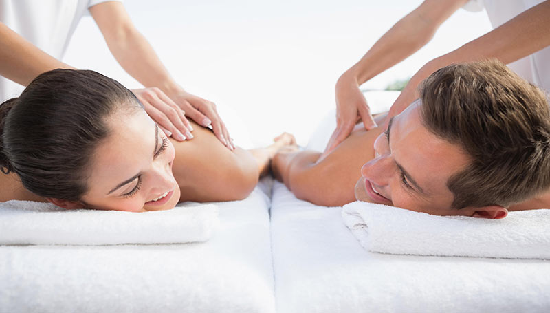 A couple receiving a couples massage together